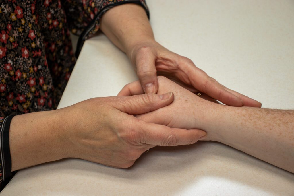 A picture of an occupational therapist performing joint mobilization for occupational therapy at STAR Physical Therapy.