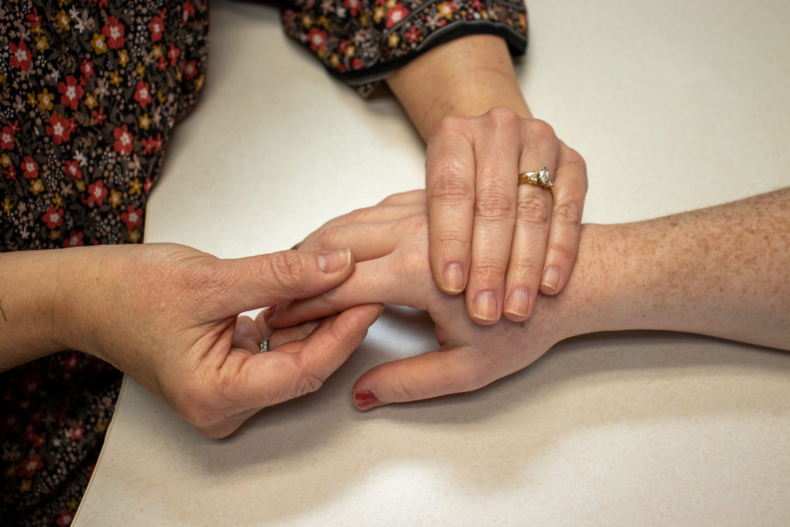 A picture of a hand therapist performing joint mobilization for hand rehabilitation at STAR Physical Therapy.